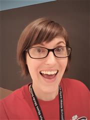 Photo of Rebecca Weiss. Short Brown Hair, Blue Eyes, Red Shirt. Photo of Rebecca Weiss. Short Brown Hair, Blue Eyes, Red Shirt.