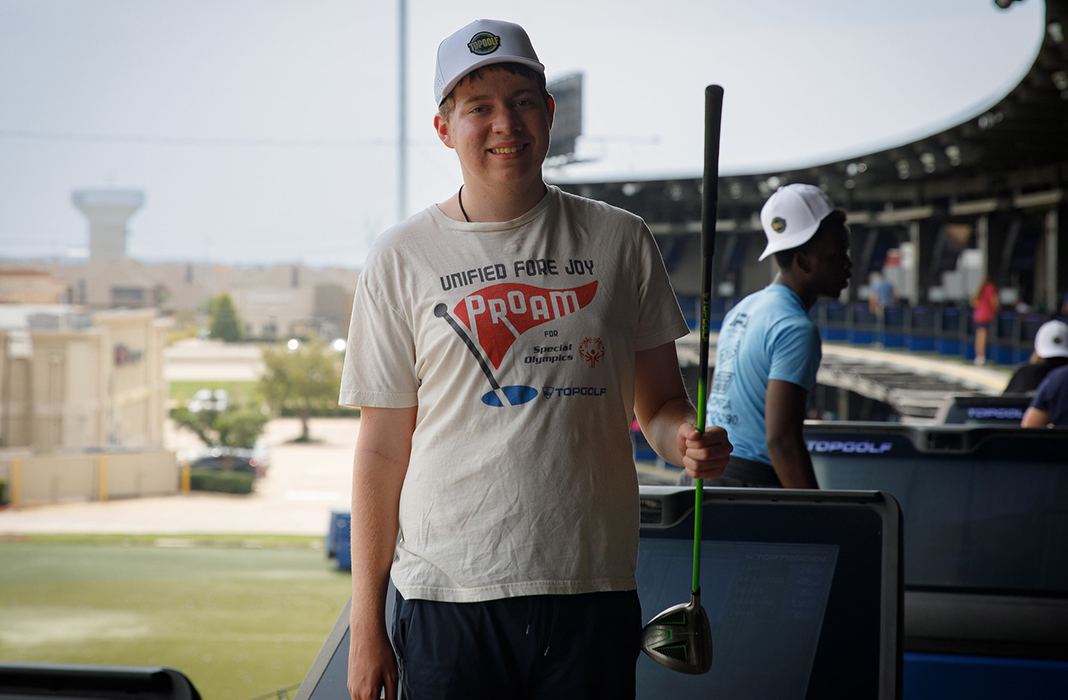 Student Holding Golf Club