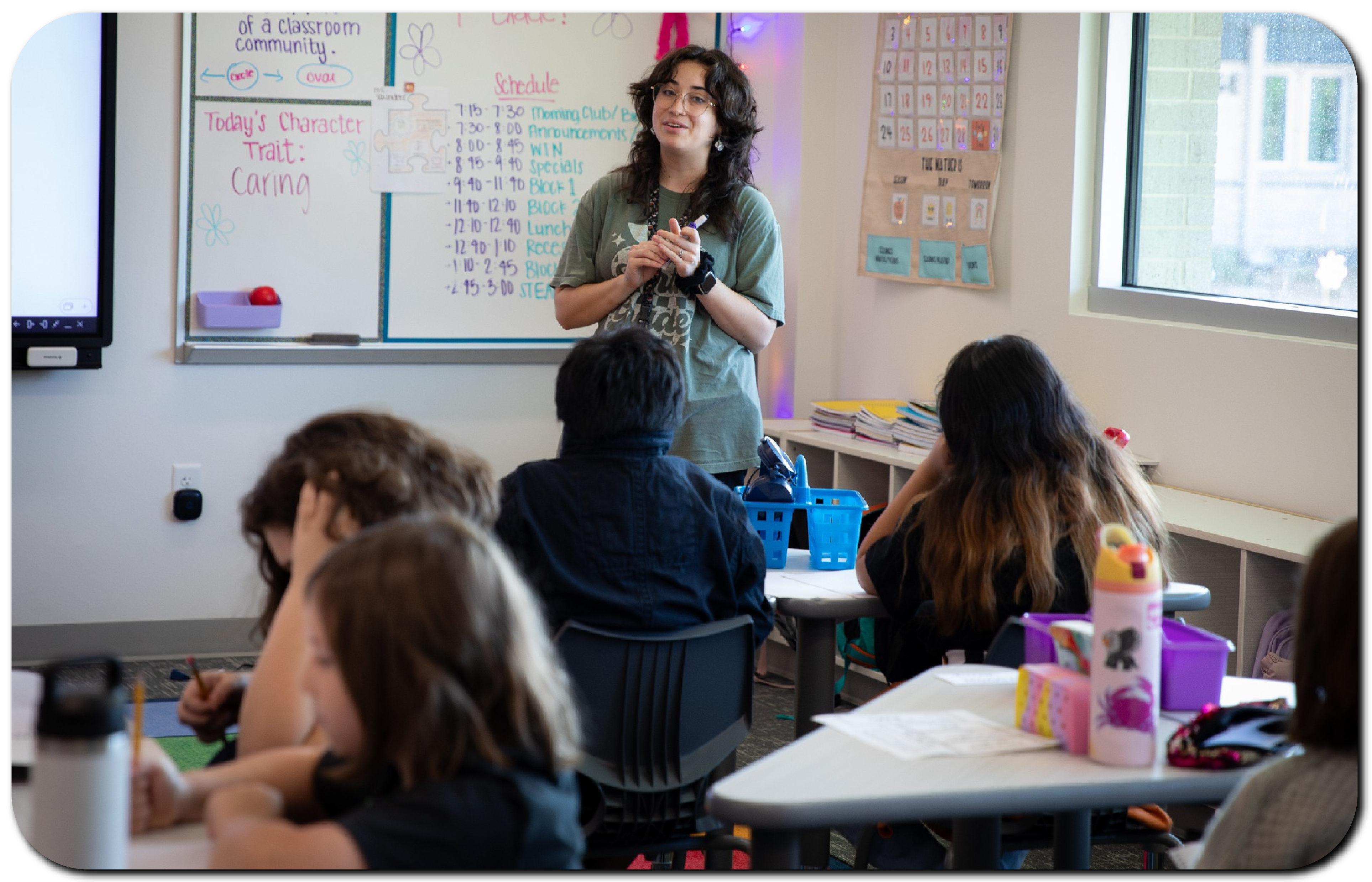 Teacher in class with students teaching