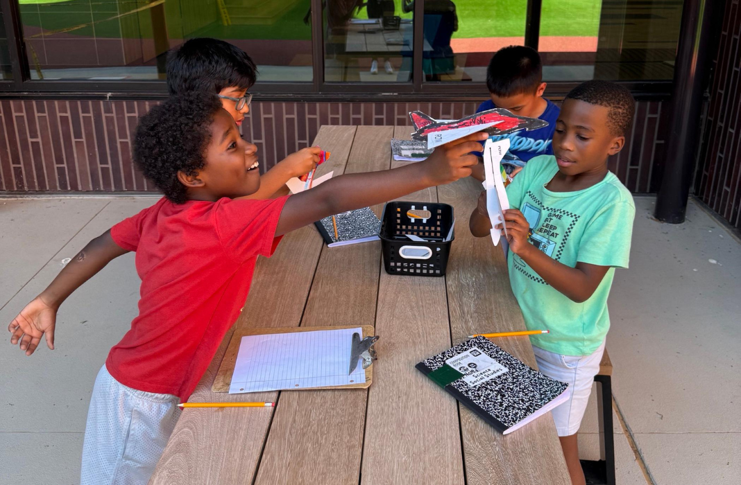  third graders showing off their gliders
