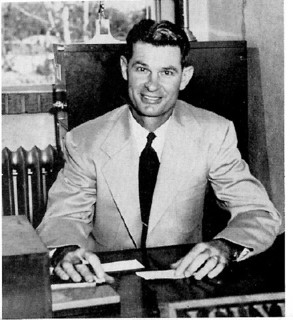 John H. Guyer at his desk 