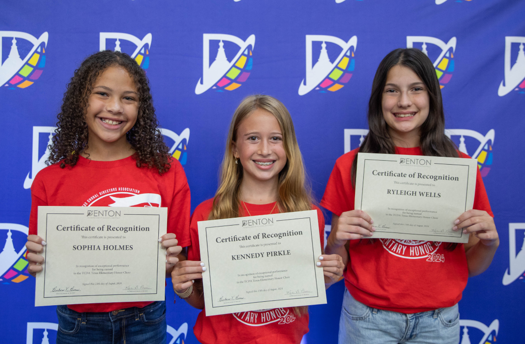 Students posing with certificates